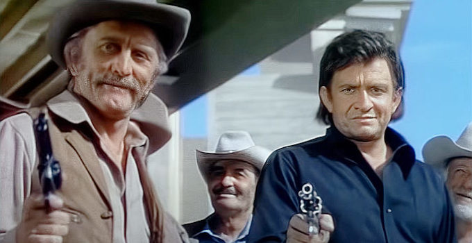 Kirk Douglas as Will Tennerary and Johnny Cash as Abe Cross in A Gunfight (1971)