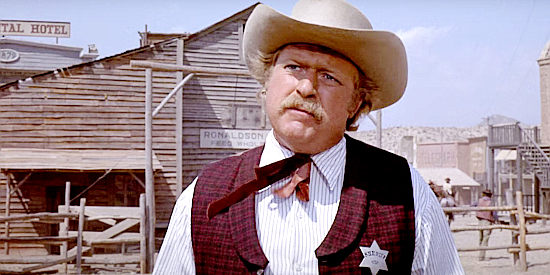 Richard McKenzie as Sheriff Behan, trying to prevent a gunfight in Doc (1971)