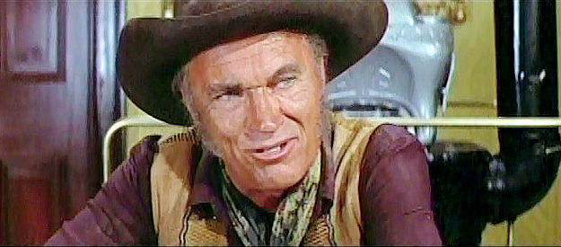 Robert J. Wilke as Corey Bannister, the man who roughs up Jenny in The Cheyenne Social Club (1970)