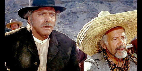 Burt Lancaster as Valdez and Frank Silvera as Diego, watching as Tanner's men converge on a man suspected of murder in Valdez is Coming (1971)