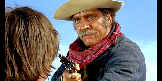 Burt Lancaster as Valdez, with one of Tanner's men under his gun in Valdez is Coming (1971)