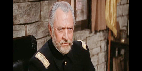 Carl Benton Reid as Col. Owens, filling Capt. Roper in on the Rebel prisoners who escaped in Escape from Fort Bravo (1953)