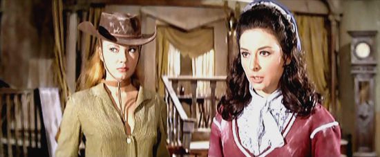 Daniela Igliozzi as Judy Masterson answers an outlaw's questions while Shlley (Maria Silva) looks on in Kill the Wicked (1968)