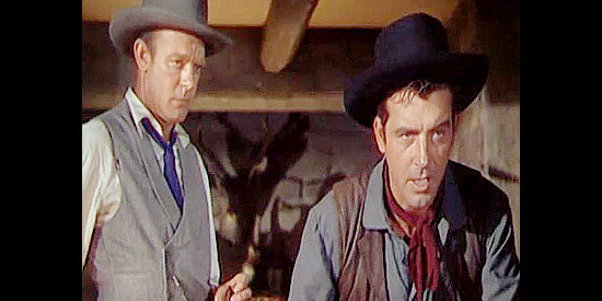 Dennis O'Keefe as Whitney Randolph and John Payne as Todd Croyden, trying to talk sense into Liguras in The Eagle and the Hawk (1950)