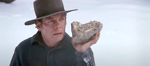 Doug McGrath as Spider Conway, about to be sorry for taunting LaHood with the gold-laden rock he discovered in Pale Rider (1985)