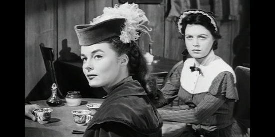 Elaine Stewart and Faith Domergue as sisters Beth and Martha Drury, trying to make their way West for a reunion with the former's fiance in Escort West (1959)