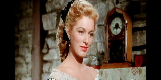 Eleanor Parker as Carla Forester, beginning her mission of turning Capt. Roper's head to help her beau gain freedom in Escape from Fort Bravo (1953)