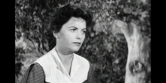 Faith Domergue as Martha Drury, holding a grudge from the Civil War against all things Confederate, including Ben Lassiter, in Escort West (1959)