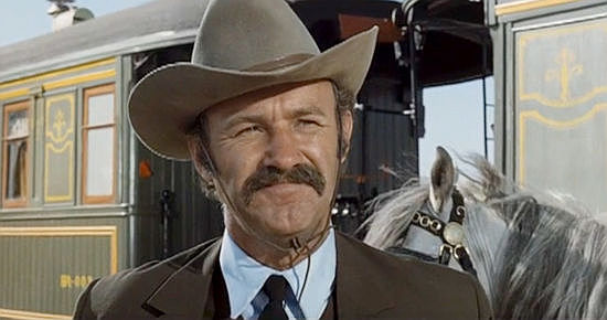 Gene Hackman as Brandt Ruger, bidding farewell to wife Melissa as his hunt begins in The Hunting Party (1971)