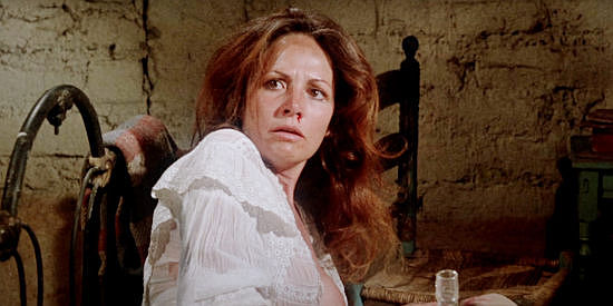 Isela Vega as Maria, learning Frank Brand has sold his rights to whore her out in The Deadly Trackers (1973)