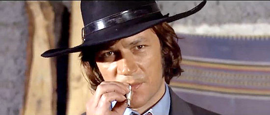 Jeff Cameron as Alan Boyd, the hired killer town leaders turn to in Bounty Killer for Trinity (1972)