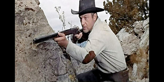 John Larch as Hal Carmody, Hunter Boyd's right-hand man, trying to ambush Tod Lohman in From Hell to Texas (1958)