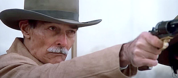 John Russell as Stockburn, the marshal LaHood brings to town along with his six deputies in Pale Rider (1985)