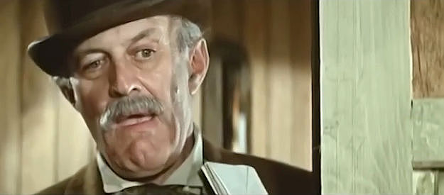 Lee J. Cobb as Duffy, sneaking a peek at a bathing Alexandra in Macho Callahan (1970)