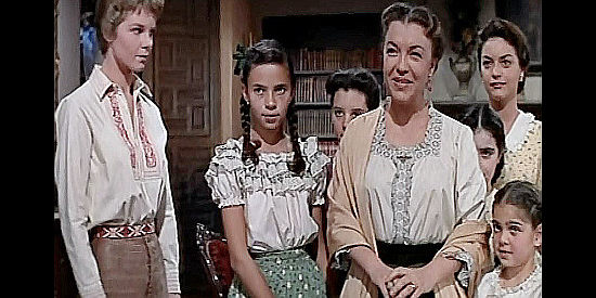 Margo as Mrs. Bradley, surrounding by her husband's six daughters, including Juanita (Diane Varsi, left) in From Hell to Texas (1958)