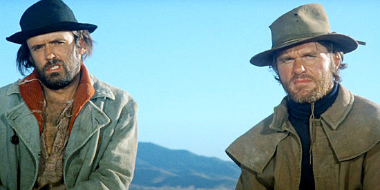 Matt Clark as Nick the Grubb and Bill McKinney as Fermel Parlee, small-time outlaws about to become enforcers in The Life and Times of Judge Roy Bean (1972)