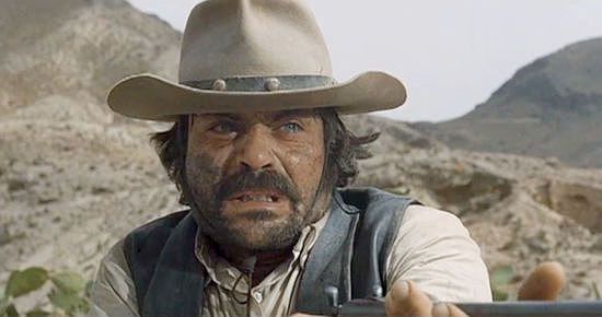 Oliver Reed as Frank Calder, forced to pull the trigger on one of his own men in The Hunting Party (1971)