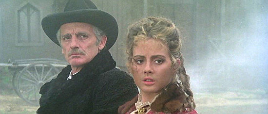 Philippe Leroy as Edward McGowan and his daughter Deborah (Sonja Jeannine) watch Waller and his men attack Blade in A Man Called Blade (1977)