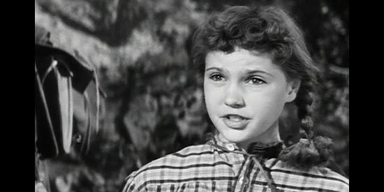 Reba Waters as Abbey Lassiter, concerned about her father's safety again as they work their way West in Escort West (1959)