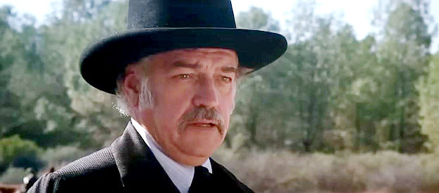 Richard Dysart as Coy LaHood, the businessman determined to expand his mining operation in Pale Rider (1985)