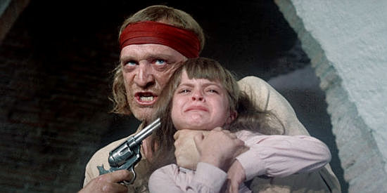 Richard Harris as Sean Kilpatrick, getting a chance to turn the tables on Frank Brand in The Deadly Trackers (1973)