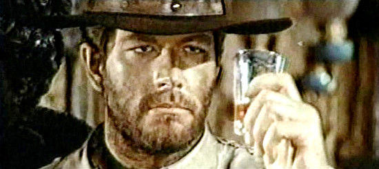 Richard Harrison as Rocco Barret, raising a glass to revenge in Vengeance (1968)