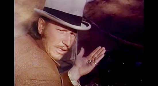 Robert Tessier as Two-Card Charlie, finding gold nuggets in an Apache camp in Cry Blood, Apache (1970)