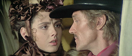 Sonja Jeannine as Deborah McGowan with John Steiner as Theo Waller in A Man Called Blade (1977)