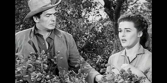 Victor Mature as Ben Lassiter, trying to console Beth Drury (Elaine Stewart) in Escort West (1959)