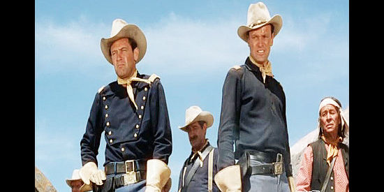 William Holden as Capt. Roper and Richard Anderson as Lt. Beecher, finding troopers staked out and dead in Escape from Fort Bravo (1963)