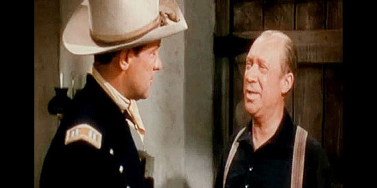 William Newell as Symore, Capt. Roper's personal assistance, wishing him a safe trip in Escape from Fort Bravo (1953)