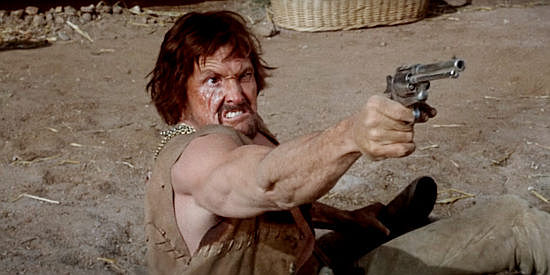 William Smith as Schoolboy, desperate to escape a botched robbery in The Deadly Trackers (1973)