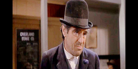 Anthony Newley as Trevor Peacock, the whiskey salesman who wants no part of Indian trouble in Stagecoach (1986)