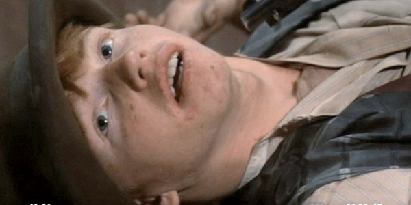 Courtney Gains as Red Dick, the red-headed piano player who falls for Rosie Velez and all her curves in Lust in the Dust (1985)