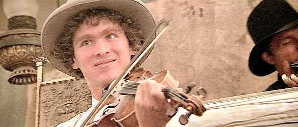 David Mansfield as John DeCory, playing a special waltz for Jim and Ella in Heaven's Gate (1980)