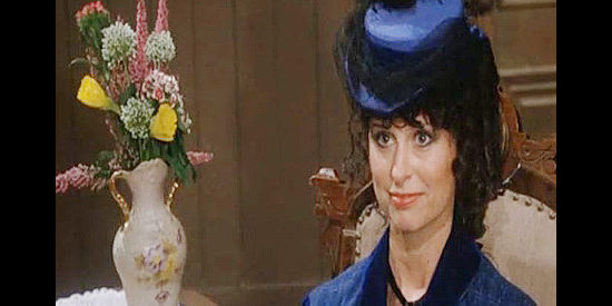 Jessi Colter as Martha, threatening to expose her affair with Gatewood if he isn't more attentive in Stagecoach (1986)