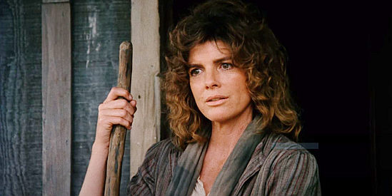 Katharine Ross as Laurie, confronted with two strangers with lustful intentions in Red Headed Stranger (1986)