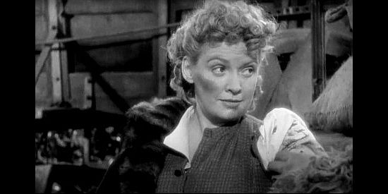 Kitty Kelly as Daisy Devine, learning she's fortunate to be 'fleshy' as Sneezer mends her wounded arm in Geronimo (1939)