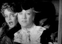 Ellen Drew as Alice Hamilton and Marjorie Gateson as Mrs. Steele, terrified as Geronimo approaches their stagecoach in Geronimo (1939)