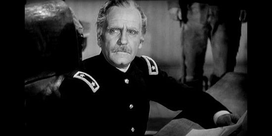 Ralph Morgan as Gen. Steele, stressing the importance of negotiating peace with the Apache leader in Geronimo (1939)