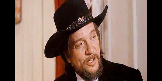 Waylon Jennings as Hatfield, the gambler who feels he owes a debt to the Mallory family in Stagecoach (1986)