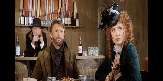 Willie Nelson as Doc Holliday, Kris Kristofferson as Rino and Elizabeth Ashley as Dallas listen to Curly's concerns about the trip ahead in Stagecoach (1986)