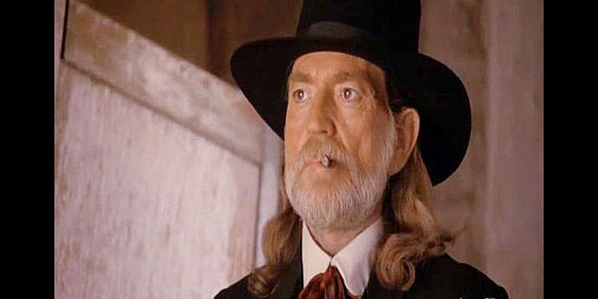 Willie Nelson as Doc Holliday, who finds some of his old skills useful in Stagecoach (1986)