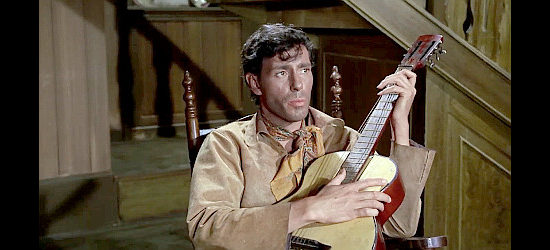 Robert Woods as Johnny 'Colt' Blythe, taking time out for a musical interlude in Starblack (1966)