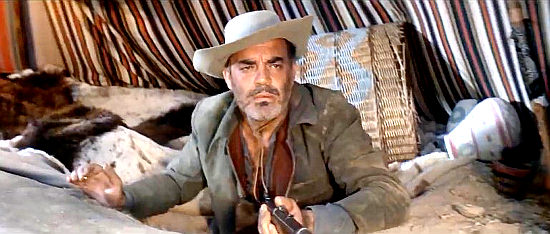 Eduardo Fajardo as Col. George Bonnett, the Confederate officer returning Apache help in Assault on Fort Texan (1965)