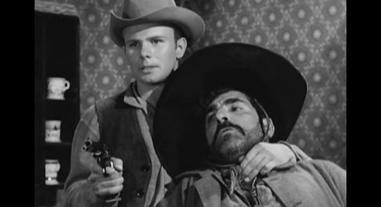 Gary Gray as Johnny, momentarily getting Juan Avila under his gun in Terror at Black Falls (1962)