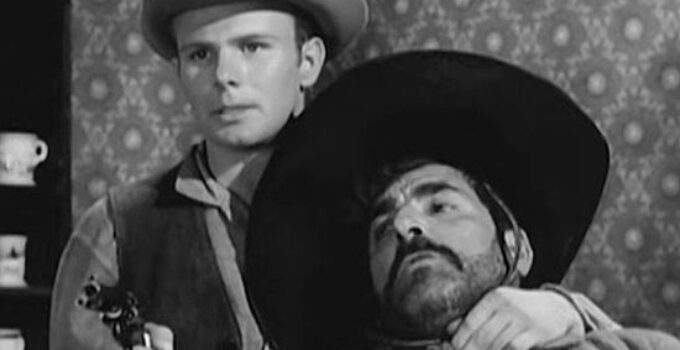 Gary Gray as Johnny, momentarily getting Juan Avila under his gun in Terror at Black Falls (1962)