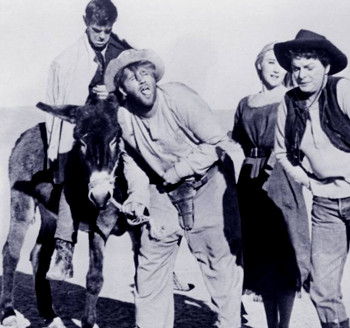 The Hagens -- from left Ritt (Gary Kent), Kirby (Allen Richards), Julie Ann (Linda Gaye Scott) and Nell (Mercedes McCambridge) -- make their way across the desert in Run Home, Slow (1965)
