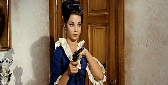 Mercedes Castro as Eva tucks a room key where Joe is sure to find it in Dynamite Joe (1967)
