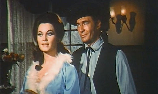 Rosalba Neri as Margaret trying to bend Luis Davila as Jim Farrell to her will in Dynamite Jim (1966)